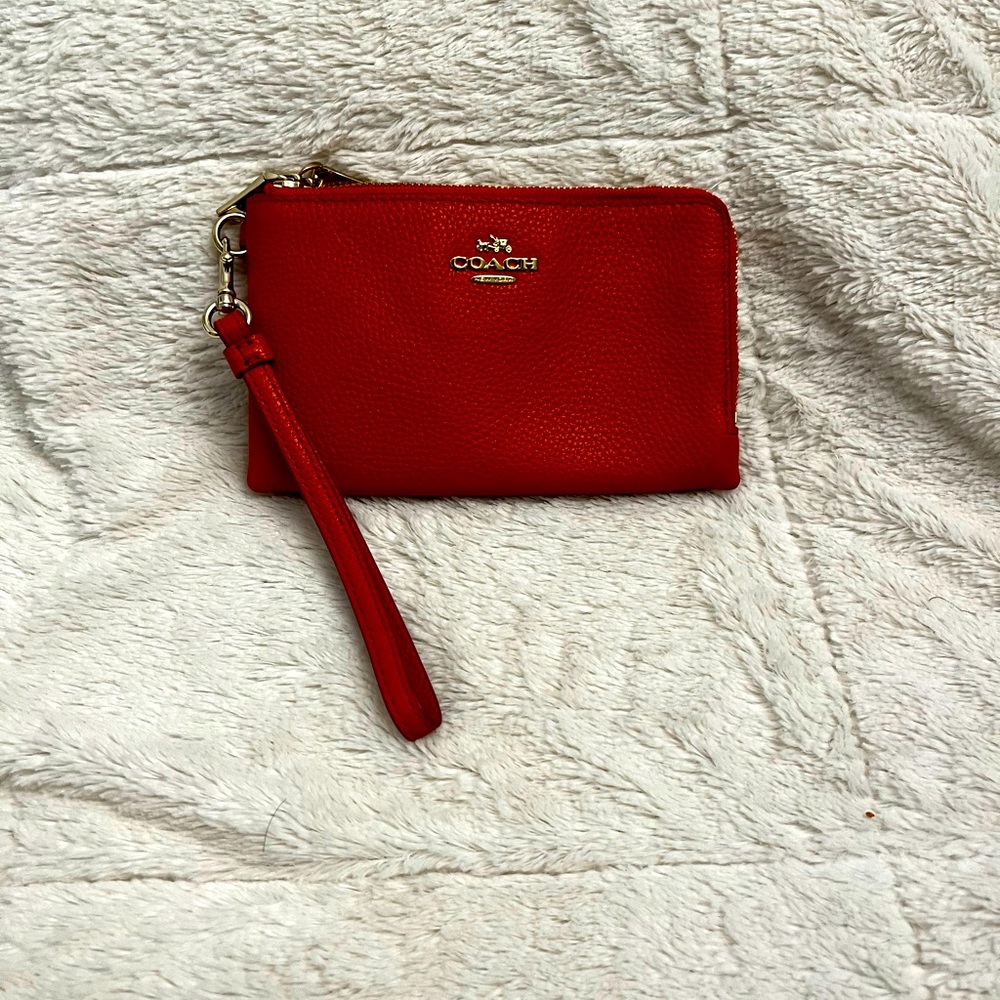 Coach double zippered pouch with leather wristlet strap. Good used condition.